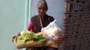 Monthly food donation receiving groceries by elder