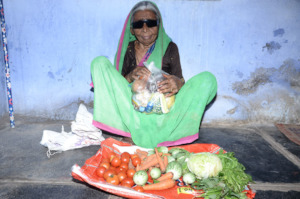 Poor old age woman getting monthly food provisions