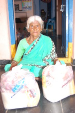 Sponsoring aged women by giving food provisions