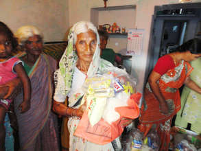 Destitute senior citizen getting monthly food