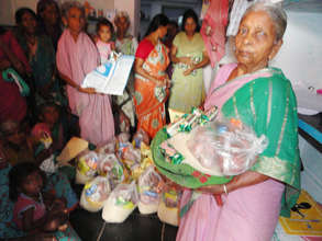 elderly woman getting monthly food donation