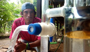Distilling essential oil in Tambopata, Peru