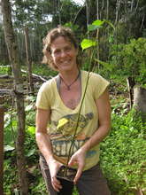 Another volunteer readying a seedling for planting
