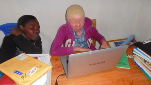 Annette Tumushime learning computer skills
