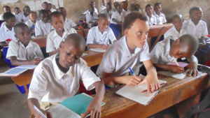 Uwase Grace (middle front) concentrates in class