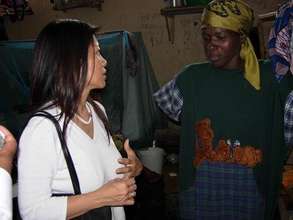 IBJ Founder Karen Tse listens to a female prisoner