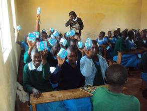 girls receiving pads in Nyaisa primary school