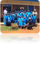 children in their new uniforms with their teachers