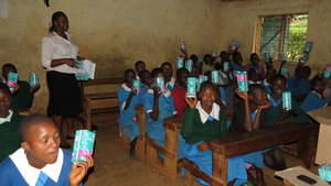 girls receiving sanitary towels