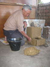 Assembling stove in Burma, now with a 5th brick