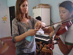 Joanne giving violin lessons