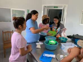 Students with Teacher Carmelina Making Cheese