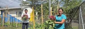 a teacher and a student at the new school garden