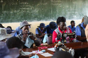 Learning how to sew kits in Zimbabwe