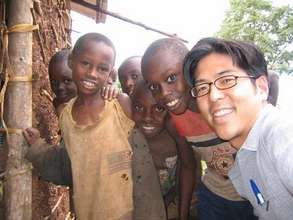 Rwanda Non-clinic Koji and boys outside
