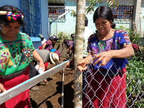 Women installing fence