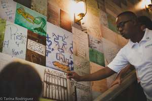 Antonio, explaining graffiti to guests