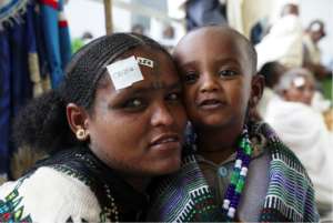 A mother awaits her surgery
