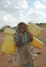 Kenya Girl with Yellow Water Jugs