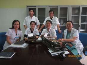 Nurses receiving blood pressure cuffs