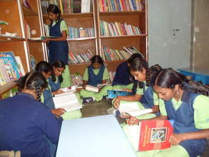 Girls in India recieving their books