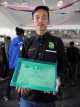 Graduate, Andre with Diploma
