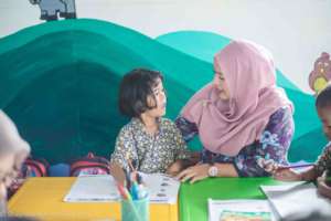 Bu Vicky with Pre Grade 1 student