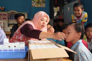 Young student gets help with medicine