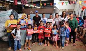 Elementary students and parents at garbage dump.