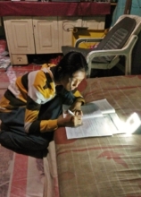 Maysaroh Studys Using Her Solar Lamp