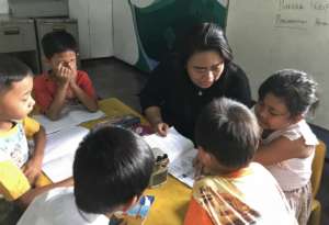 Nurlela Tutoring Her Second Grade Class