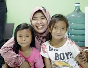 Waiting with their mother for eye exams