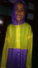Krishna very happy with his new raincoat