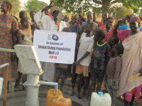 Villagers celebrate the well that will bring water