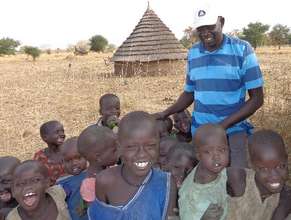 Drilling manager Ater Thiep with village children