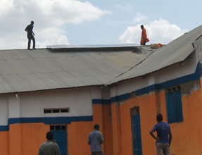 Workers installing the panels on the chapel