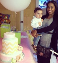 Nikki Diaz and a birthday girl with her cake.