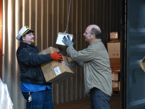 Mike and Dave load boxes for the shipment