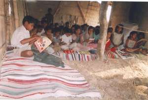 Children using school mat made out of waste cloth