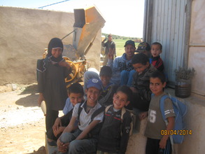 Children with L'Hussain, our water-project manager