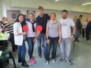 Clients and volunteers before match in ping-pong