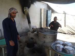 The school cooks preparing a meal for the students