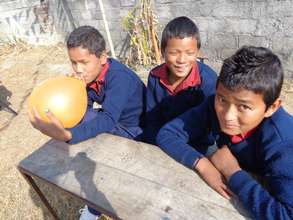 Bijay (middle) smiles and celebrates his birthday
