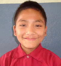 Uttam, proudly wearing his school uniform!