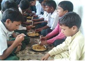Lunch being served at the Malikpur NUR Foundation