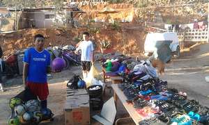 Donated sports equipment being sorted.