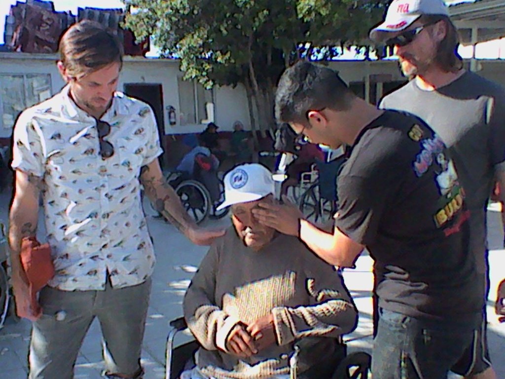 The team prays for this man's suffering eyes.