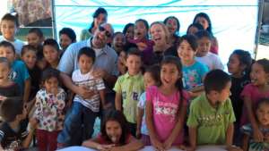 2 of the Drs with the kids after treating them.