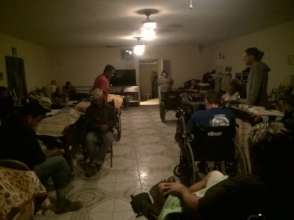 Wayne talking with and praying for other residents