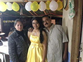 Angelica with her parents.